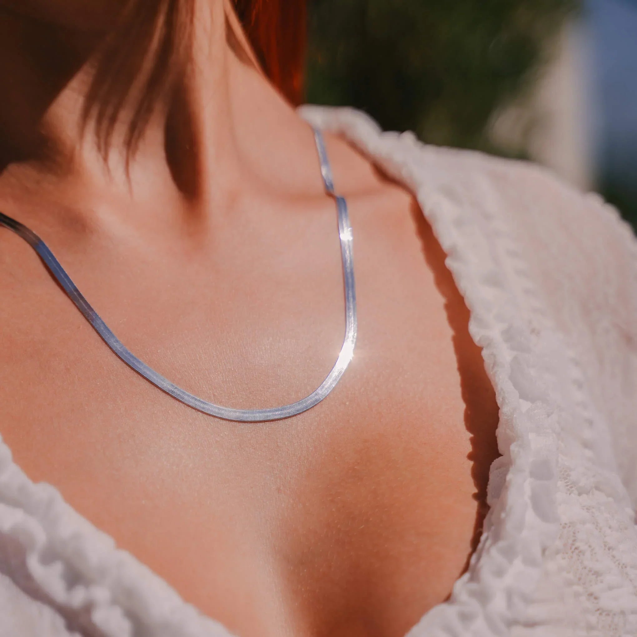 How Do You Style a Silver Herringbone Necklace?