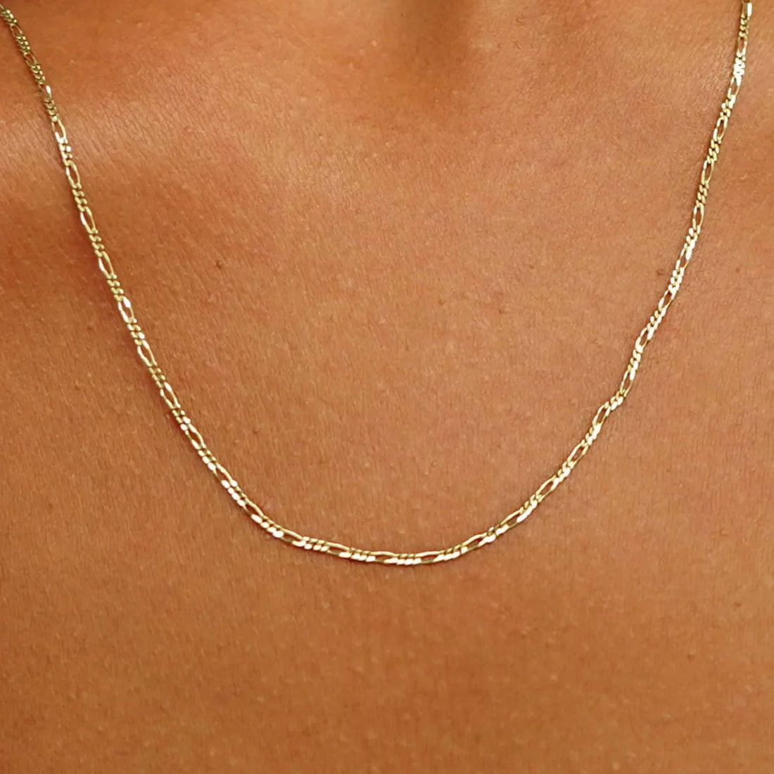 Gold Figaro Chain Style & Care Guide