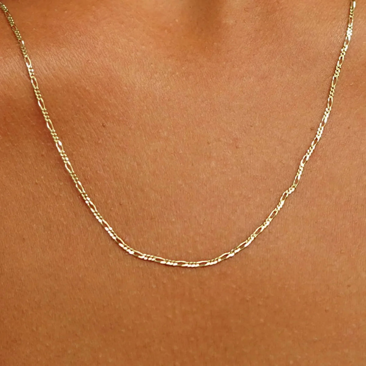 Gold Figaro Chain Style & Care Guide