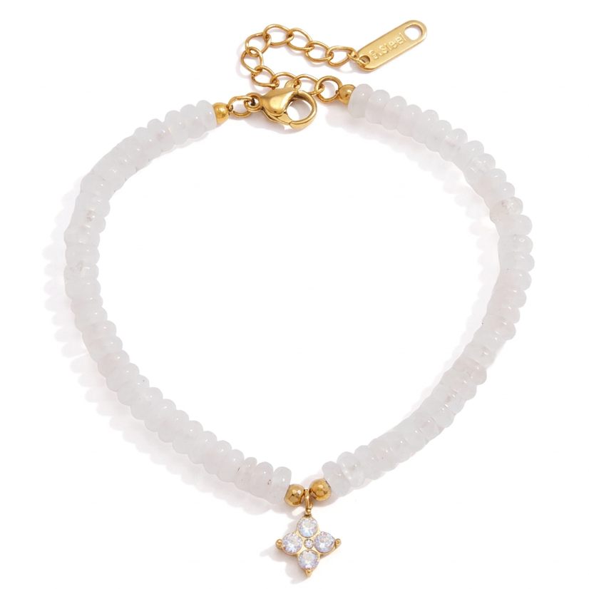 White beaded bracelet with a gold clasp and a small gold-and-white flower charm, shown on a white background.